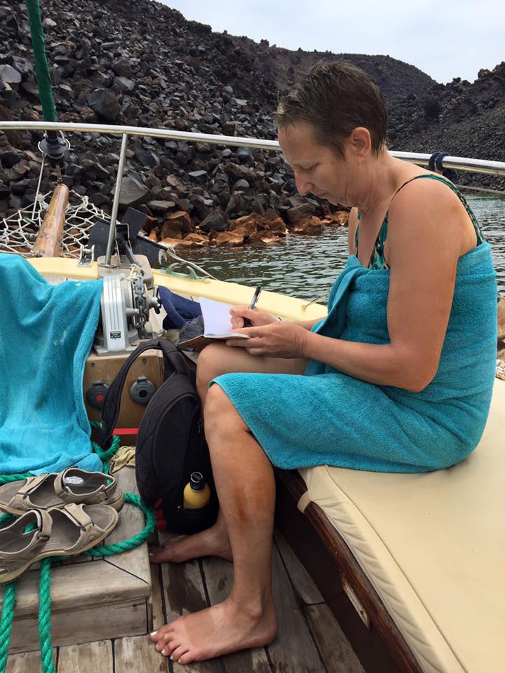 laura-davis-greece-santorini-laura-writing-on-deck