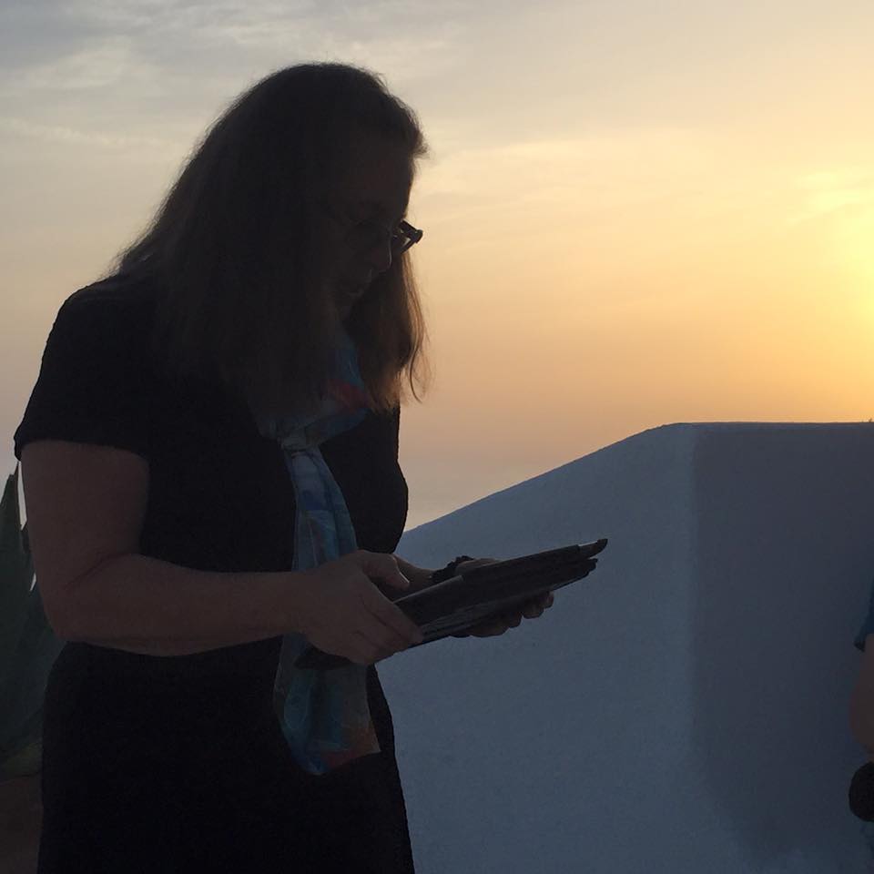 laura-davis-greece-reading-at-sunset