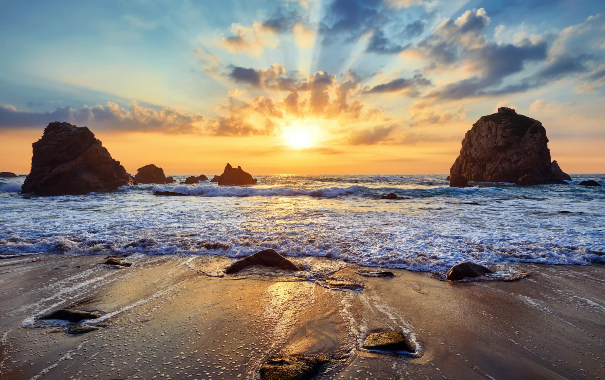 Sand beach among rocks on evening sunset. Ursa Beach near