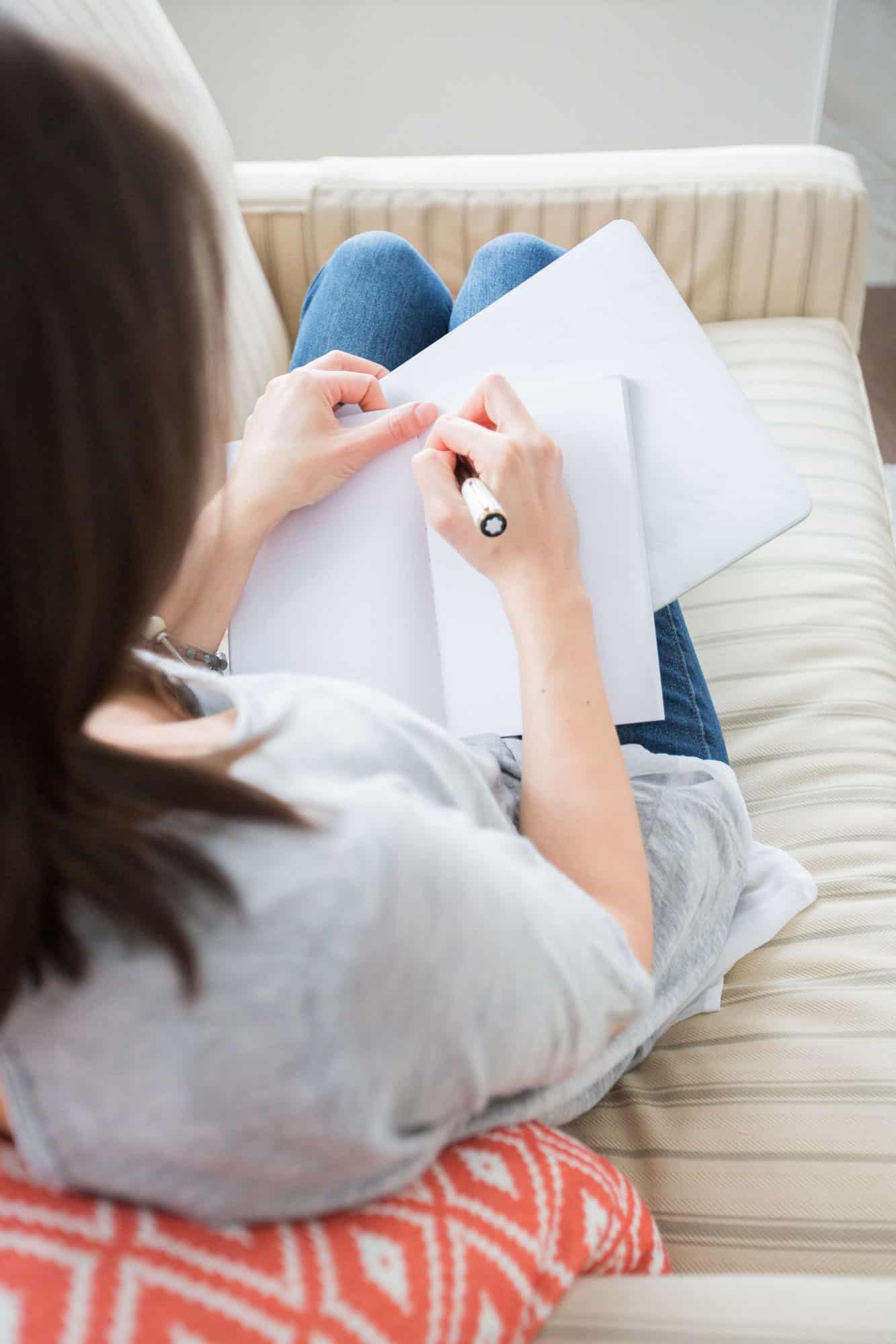 Woman Writing | Photo by Ana Tavares via Unsplash