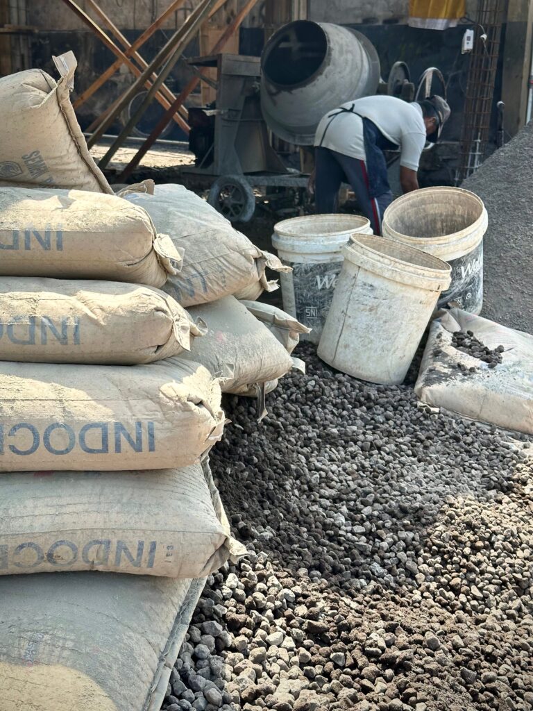 Making cement on a busy tourist street. Photo by Laura Davis