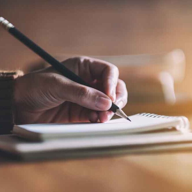 Writing in a Notebook